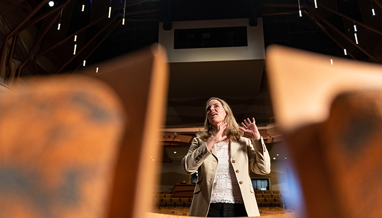 Theatre chair Kathleen Jeffs gives direction from the audience-level seating.