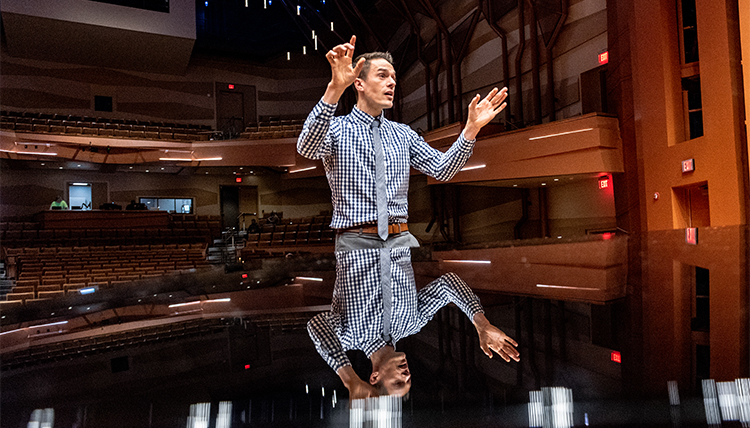 music director Tim Westerhaus reflected in piano