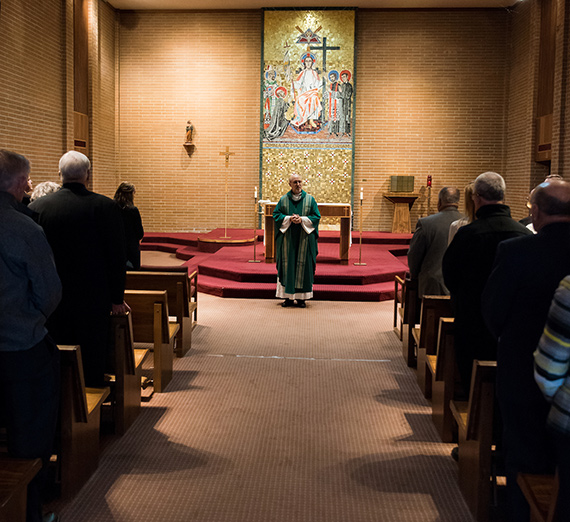 Fr. Jim Voiss leads mass in the Jesuit House chapel