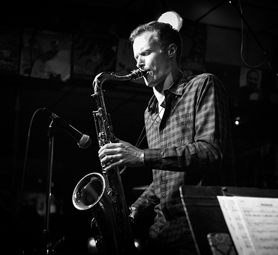 Artist Bob Reynolds plays his saxophone.