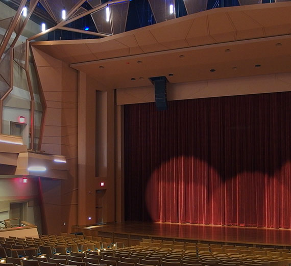 Coughlin Theater stage with curtain and spotlights