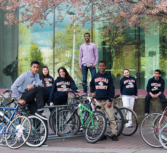 Act Six scholars pose with their bikes