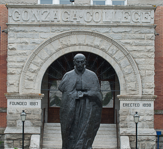The statue of St. Ignatius stands in front of College Hall