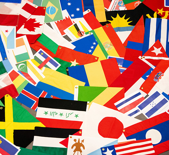 Flags from countries around the world are assembled into a circle