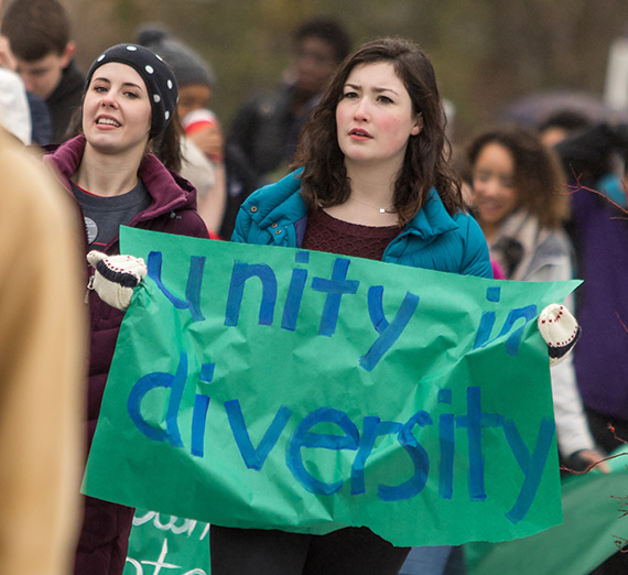 Students march for diversity with handmade signs