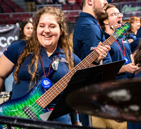 Sara Clark playing the bass with the Bulldog Band