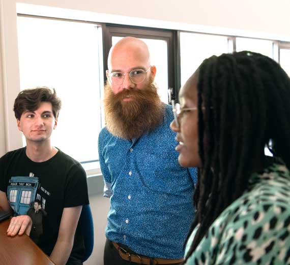 Dr. Adam Fritsch talking with students