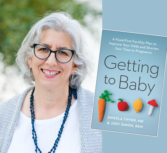 woman with gray hair and a book reading getting to baby