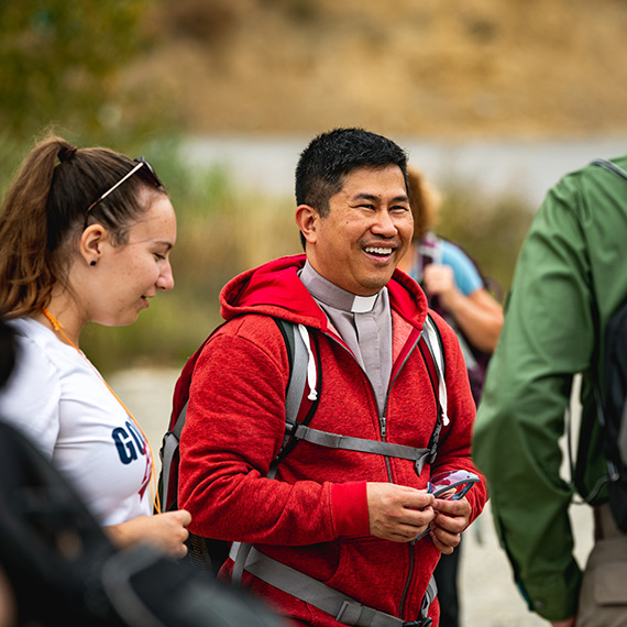 Father Bryan Pham, Gonzaga's law school chaplain, meets with students.