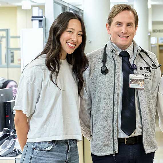 UW and GU students standing proudly