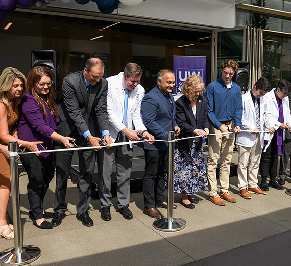 The ribbon cutting ceremony for the UW-GU Health Partnership building.