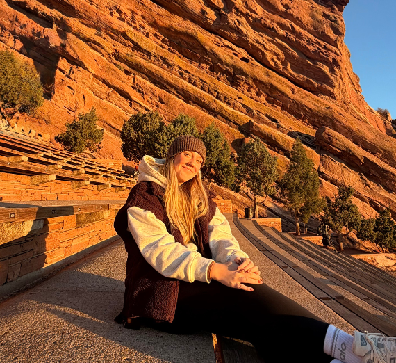 Student sits on stairs at Red Rock