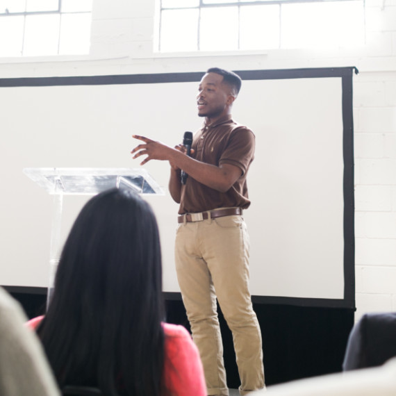 A man presenting to an audience