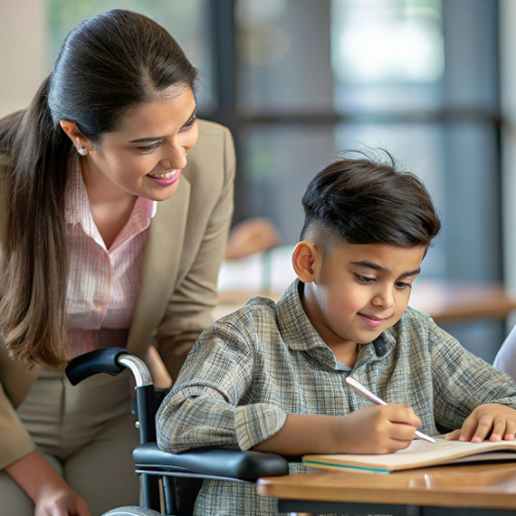 A teacher works with a student