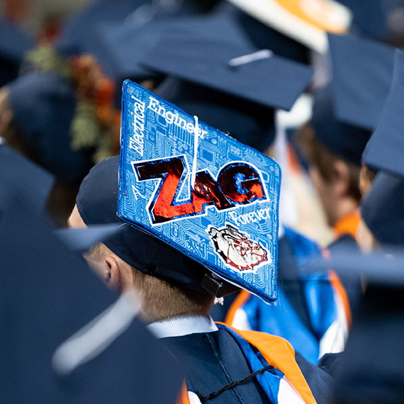A graduate cap that reads "Zag Forever"