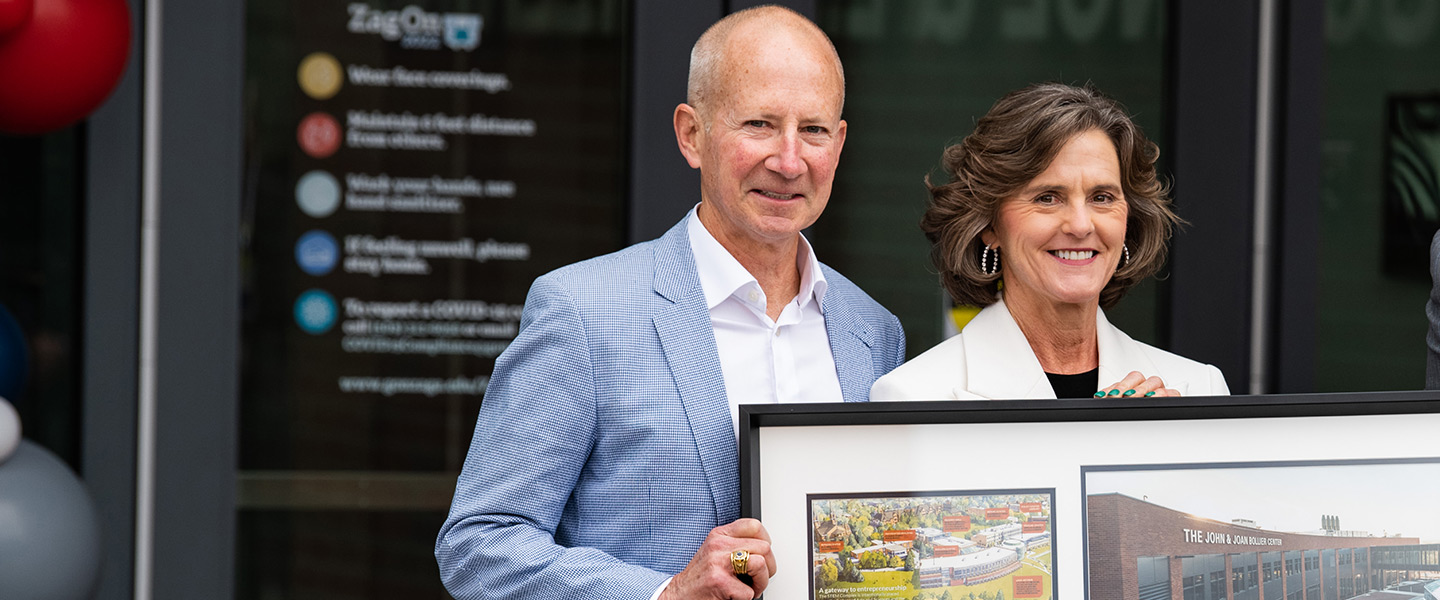 The Bolliers pose with President Thayne McCulloh.