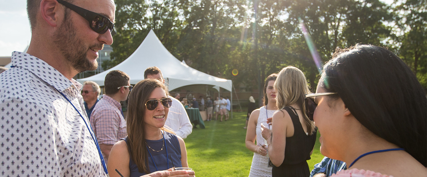 Alumni Scholarship Benefit 2019 at Gonzaga University attendees chat with one another on Foley Lawn