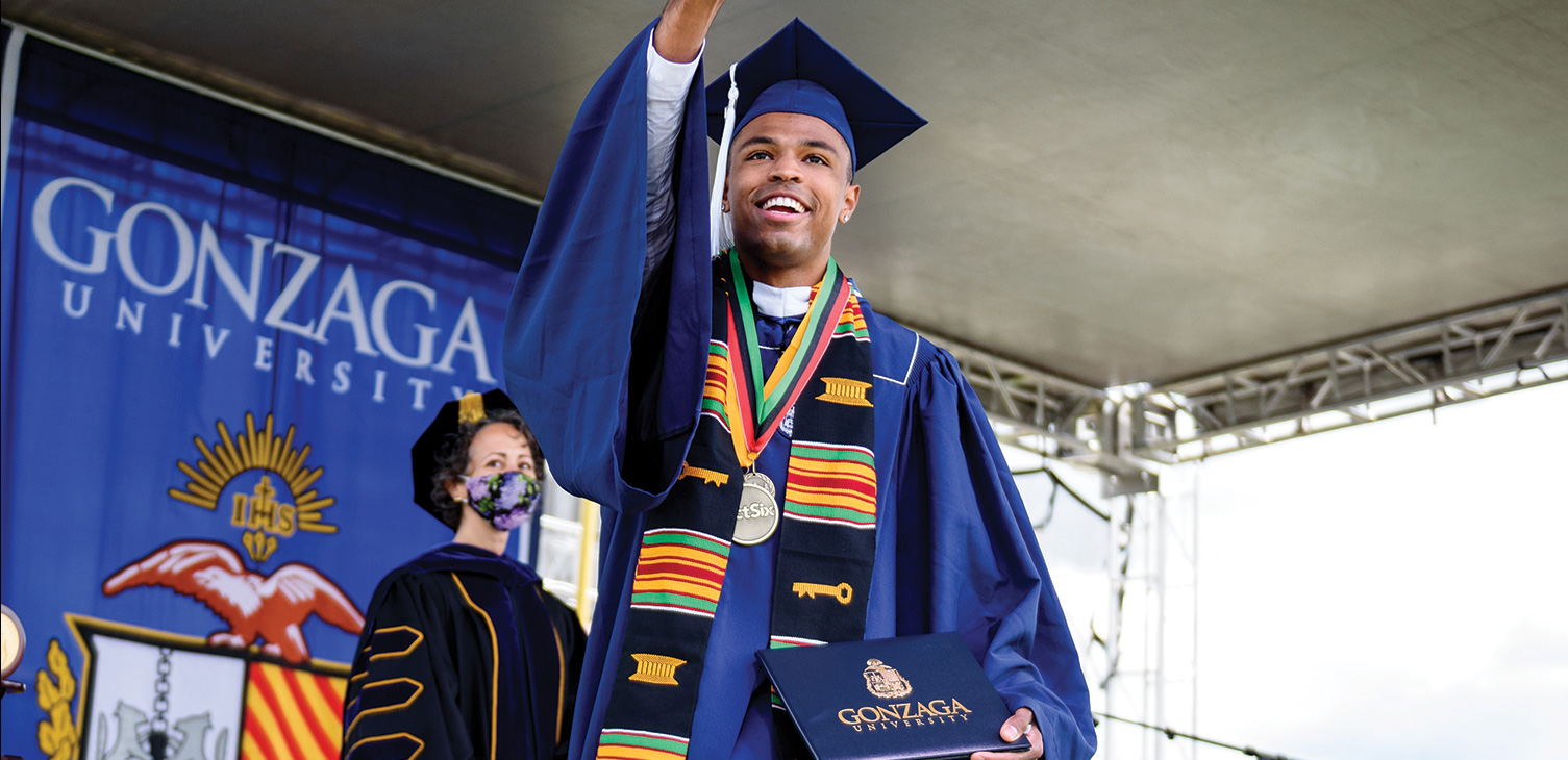 A graduate celebrates at Gonzaga's commencement ceremony.