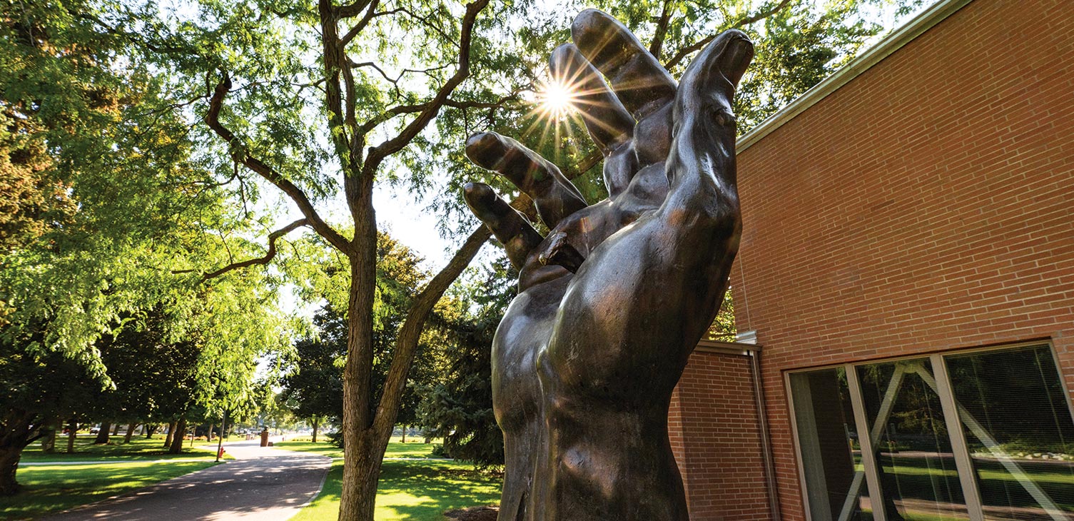 The Hand of Christ Statue in front of the Humanities Building.