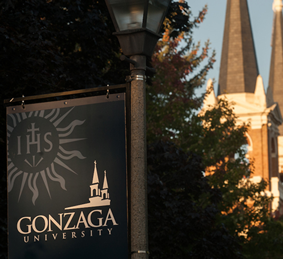 The morning sun shines on a Gonzaga sign.