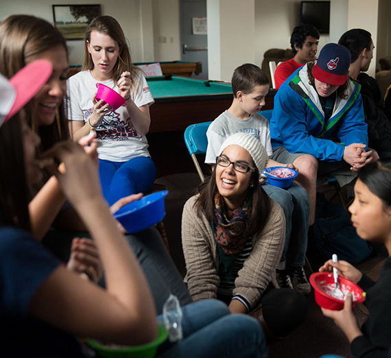 group of college students with younger children