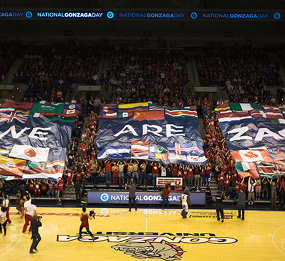 Gonzaga Students raise banners stating "We are Zags" at the Gonzaga Day basketball game.