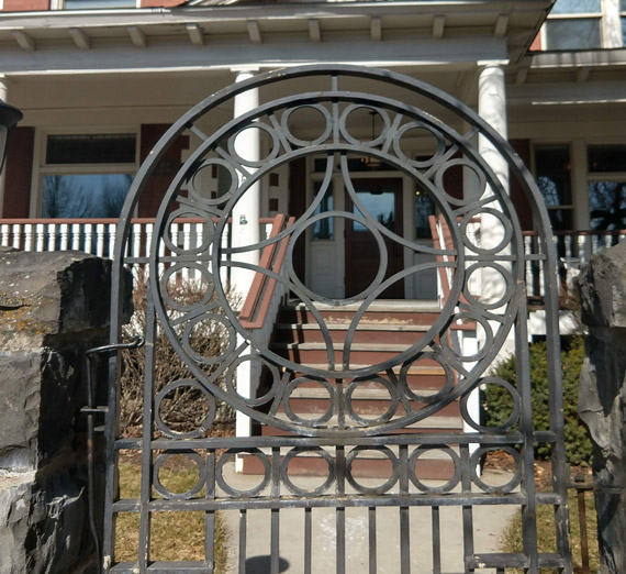 close of up round gate in front of Huetter mansion
