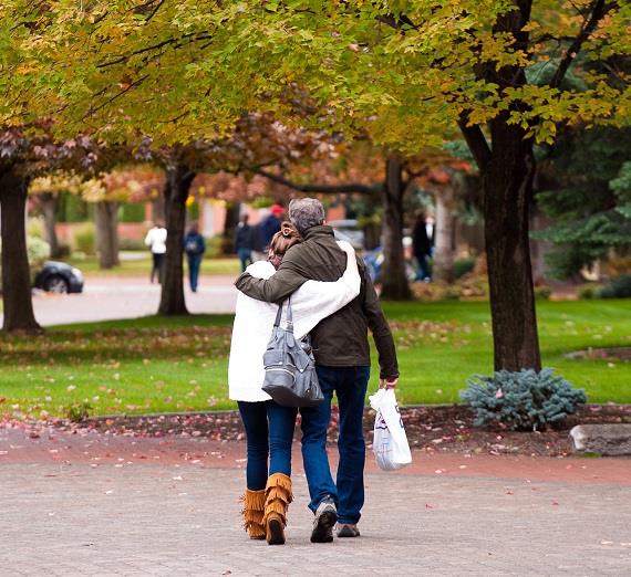 Walking and hugging during Fall Family Weekend.