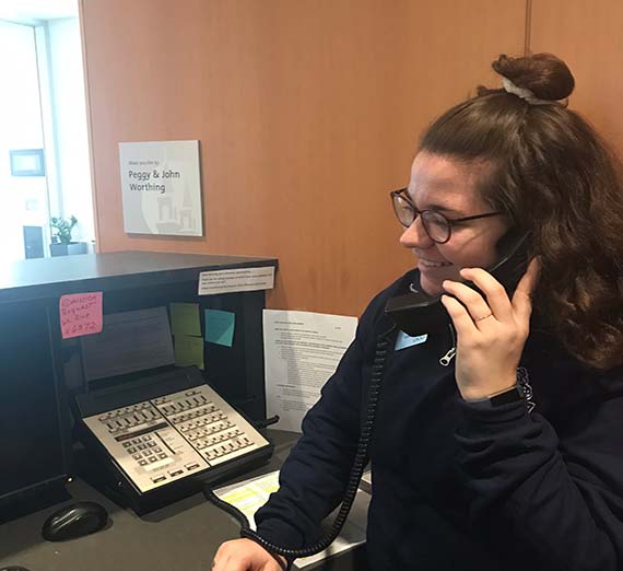 Welcome Desk staff answering phone calls to assist in coordinating requests