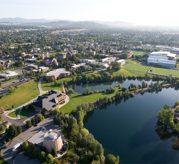 drone view of spokane river and campus 