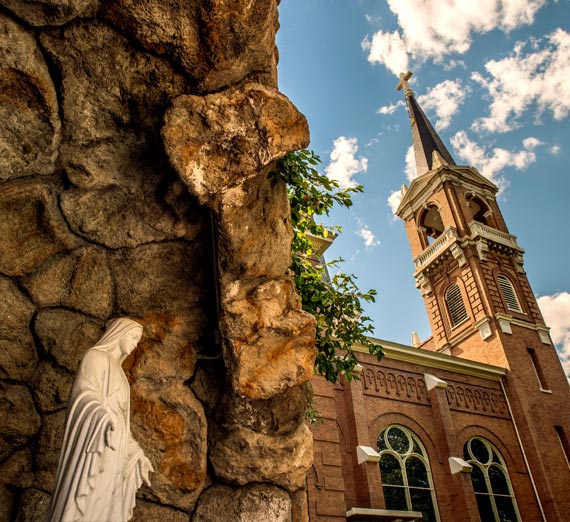 Gonzaga University grotto with statue of Mary and St. Aloysius church in background