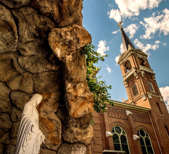 Gonzaga University grotto with statue of Mary and St. Aloysius church in background