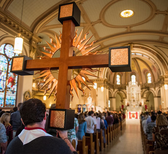 Cross being carried into Mass of the Holy Spirit, 2017