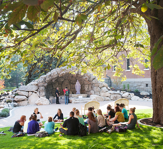 Class is held on the grass in front of the Grotto