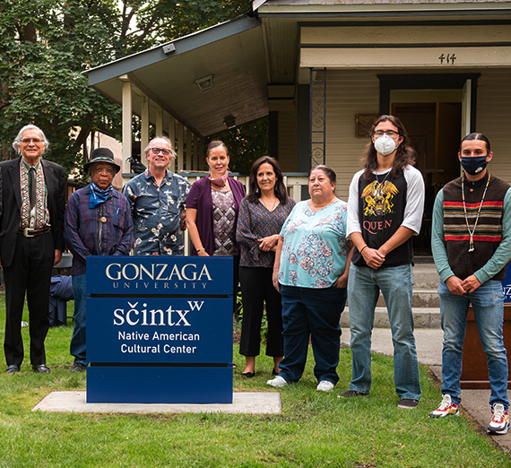 Members of the Gonzaga community pose in front Native American Cultural Center.