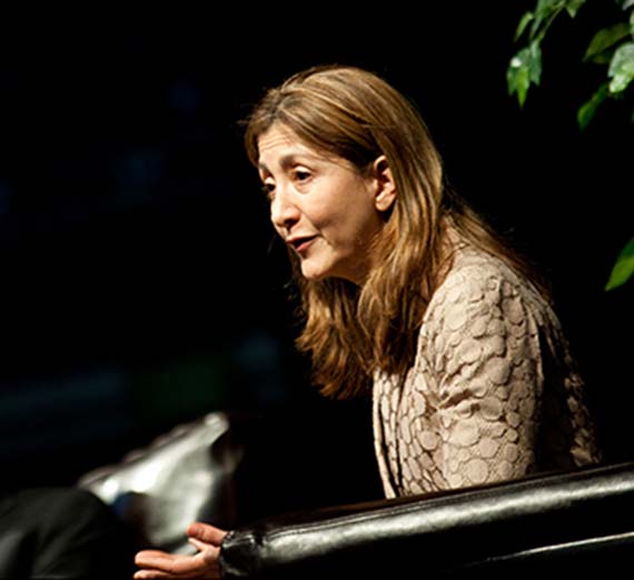 Ingrid Betancourt speaking on stage.