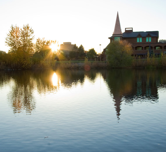 Jundt Art Museum at sunset reflecting on Lake Arthur