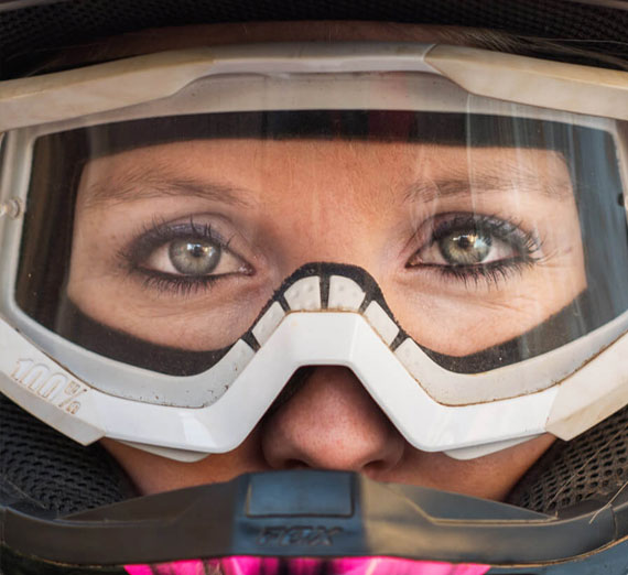Victoria Indaco (’15, B.S. Mechanical Engineering) in a baja racecar helmet 