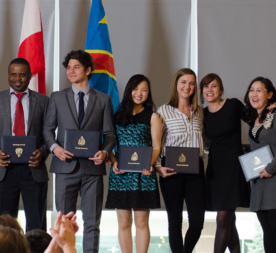 international students on stage at their ESL graduation