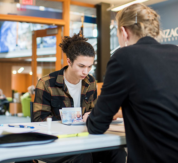 Students receive help in the Center for Global Engagement office for study abroad. 