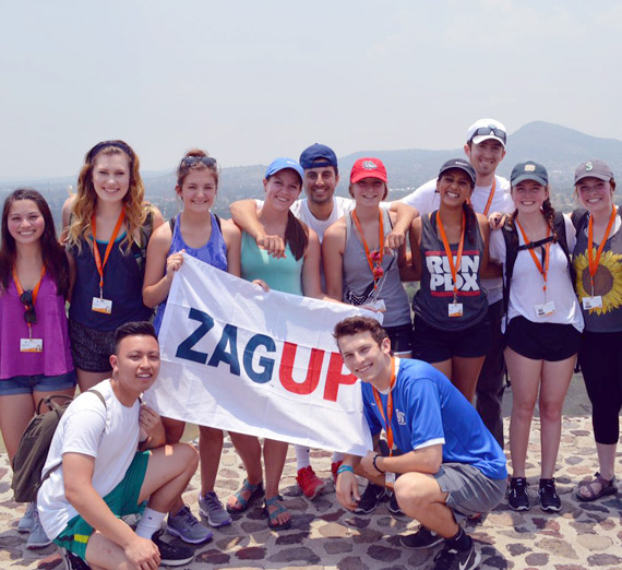 Study Abroad students group photo on top of the Sun Pyramid in Mexico 