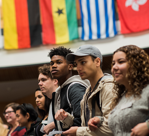 Students link arms during the International Day of Tolerance.