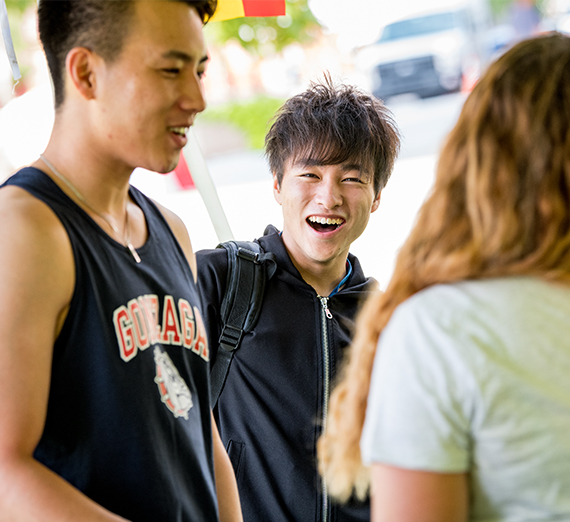 Students laugh at a CGE fair