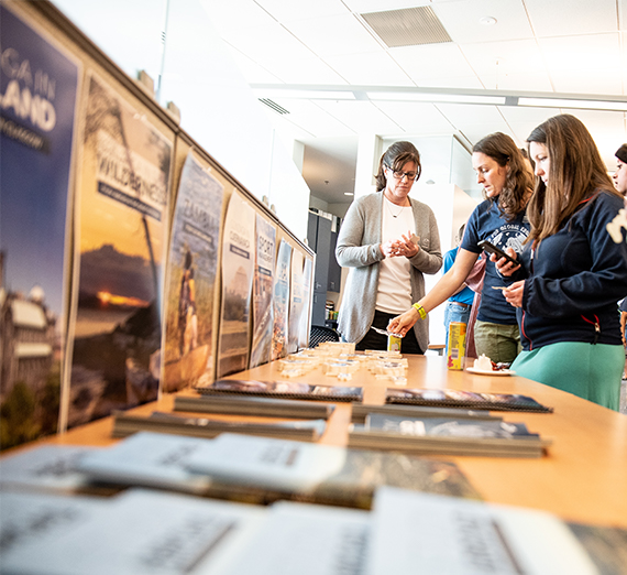 Students browse through study abroad flyers.