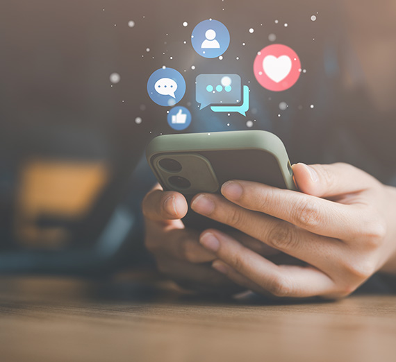 iPhone with social media bubbles coming out of it