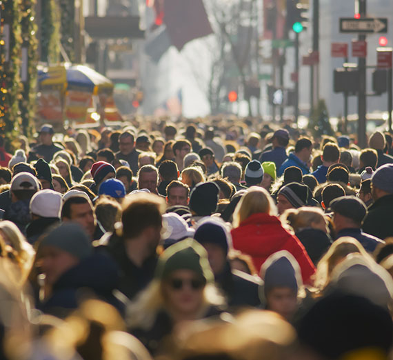 Large crowd of people walking on the street during the daytime