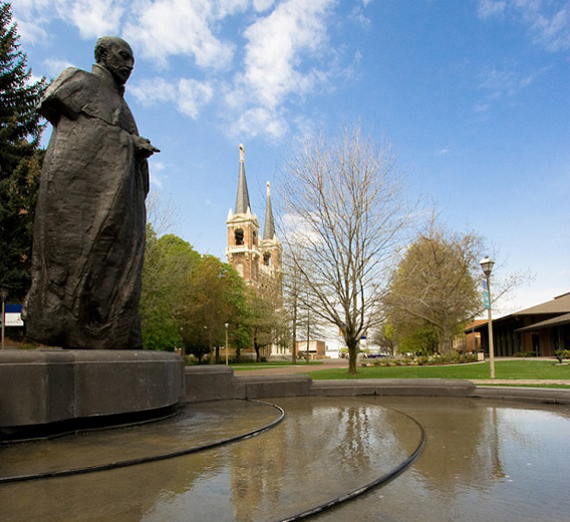 The statue of St.Ignatius in front of College Hall
