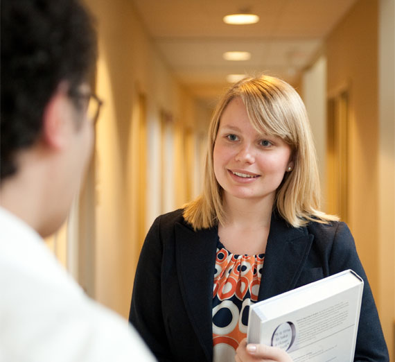 A Business student speaking with a professor 