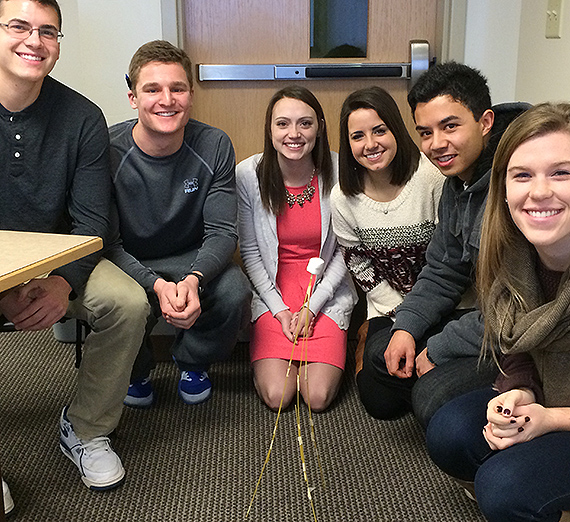 Undergraduate HR students smile together