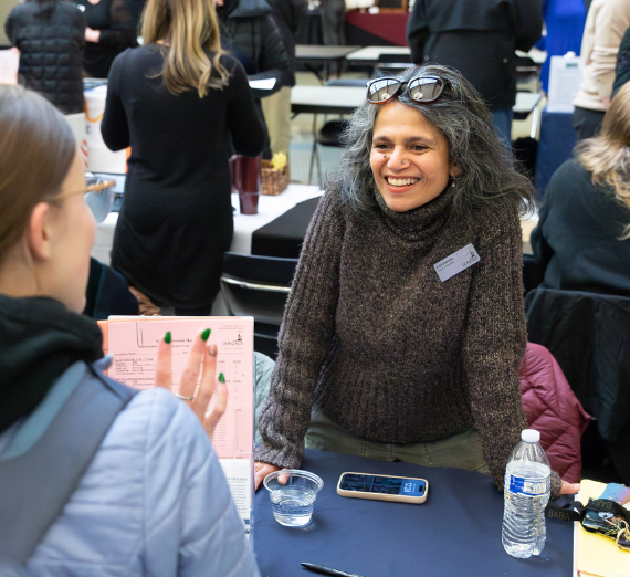 Faculty talking to student